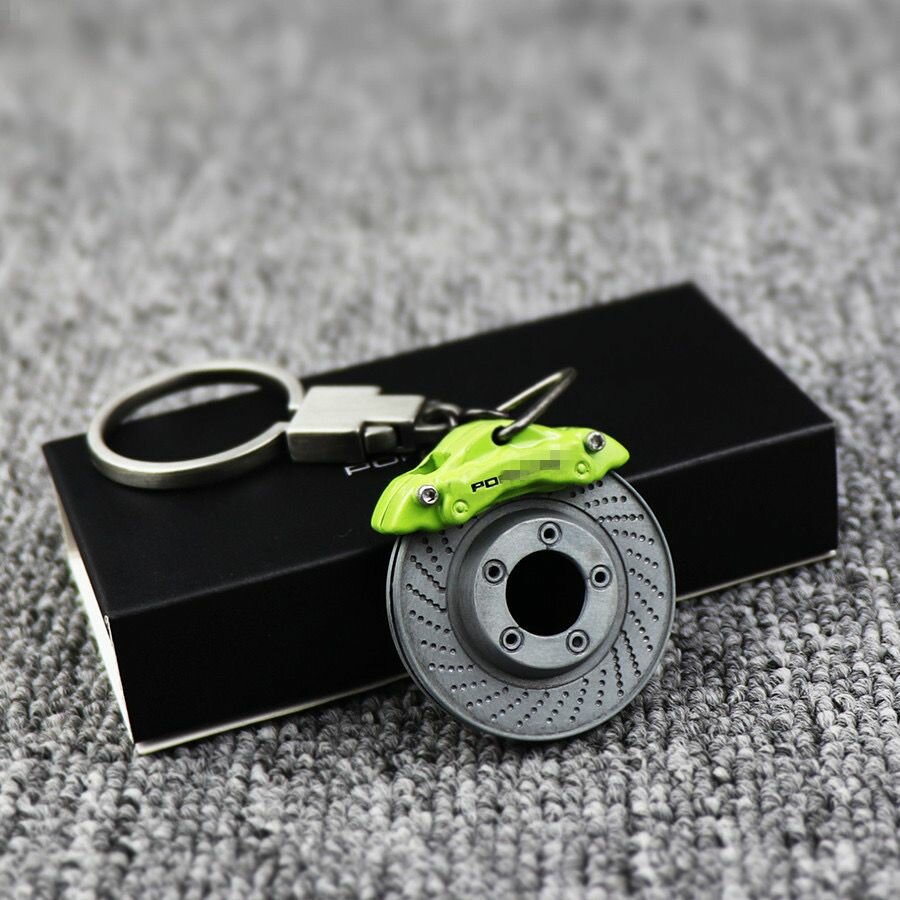 фото Брелок металлический, тормозной диск с суппортом Porsche, в фирменной коробке / подарок автовладельцу / Porsche Design