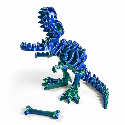фото Динозавр-скелет ти-рекс (t-rex dino) с косточкой, гибкая фигурка, сине-зеленый