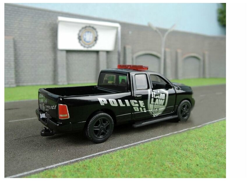 Модель автомобиля Dodge RAM 1500 Полиция США (Siku 2309) - фото №11