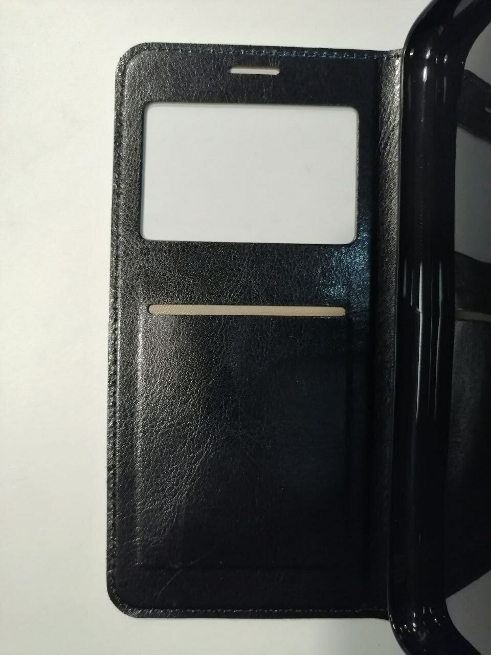 Чехол-книжка черный для Huawei P30 Lite с окошком, отделением для карт и подставкой.