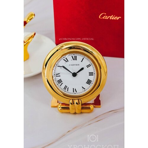 Cartier a gilt travel clock with alarm