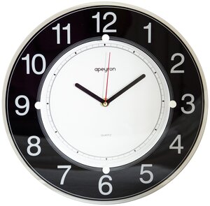 Настенные часы PL1712731-1 в форме круга из качественного пластика. Лицевая сторона защищена стеклом. На циферблате белого цвета с черным кольцом по краю расположены арабские цифры и три стрелки. Часы сохранят тишину в помещении