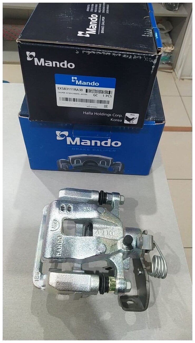 Суппорт тормозной задний правый MANDO EX583111RA30 для Hyundai Solaris, Kia Rio - фотография № 16
