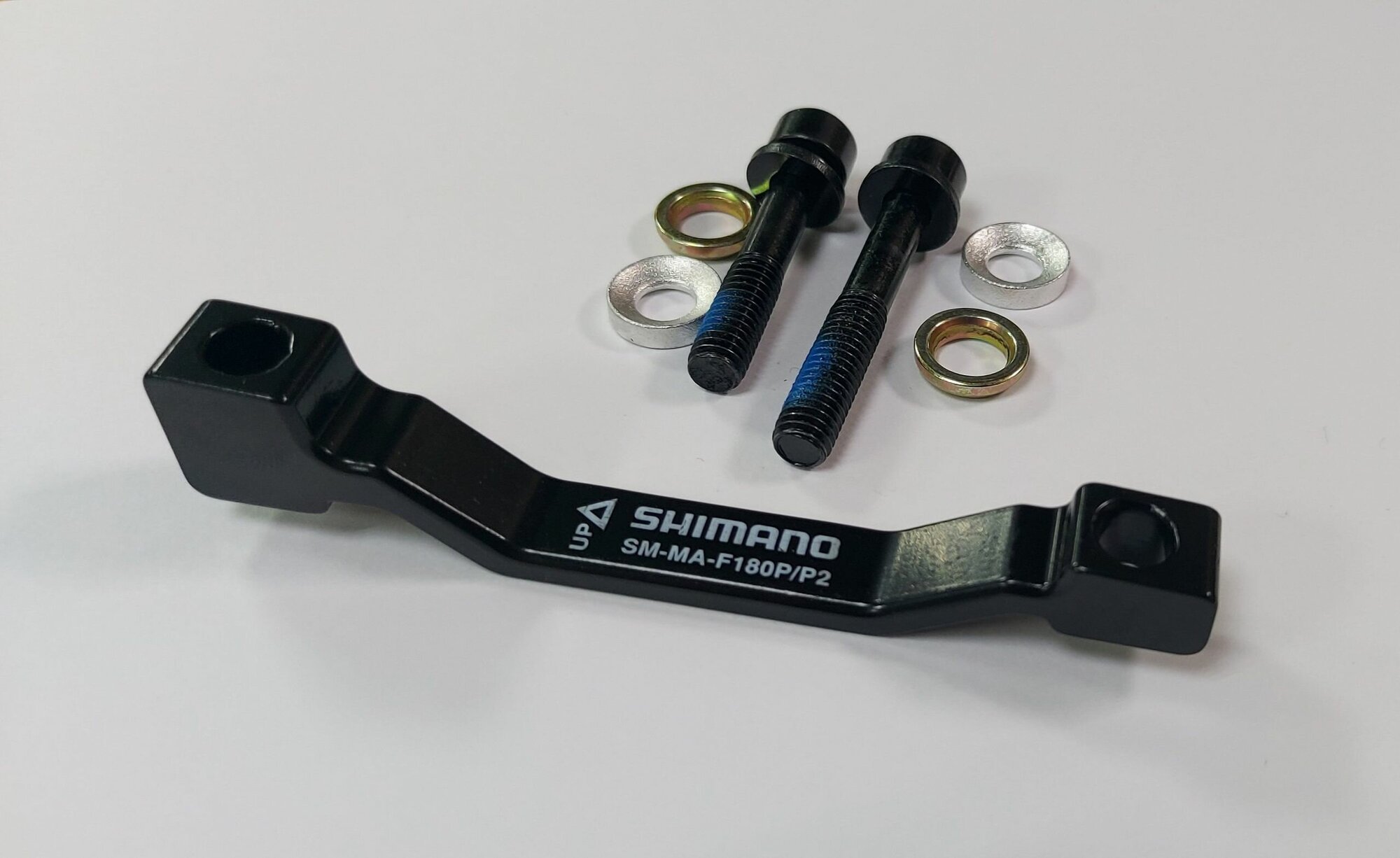 Адаптер дискового тормоза Shimano F180мм +20мм ( Сквозной )