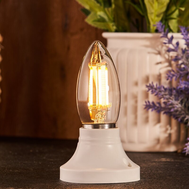 Лампочка филаментная REXANT Свеча CN35 7.5 Вт 600 Лм 2700K E27 прозрачная колба