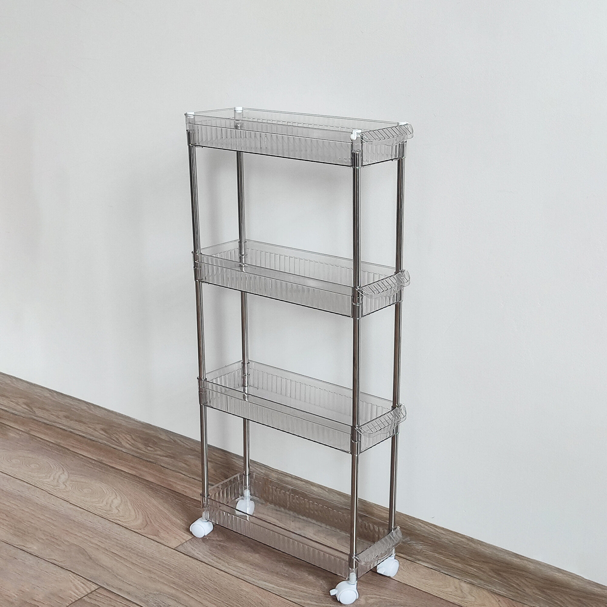 фото Этажерка метал/пластик 4-х ярусная 38,5*13,5*86 см на колесах прозрачный Baizheng