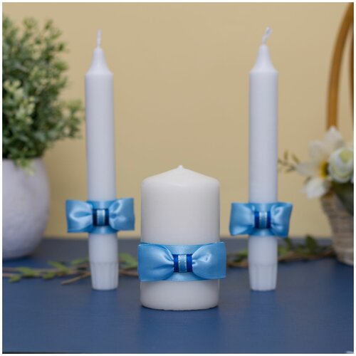 фото Набор свадебных свечей для домашнего очага "голубые банты" с атласными бантами голубого и синего цвета ручной работы свадебная мечта