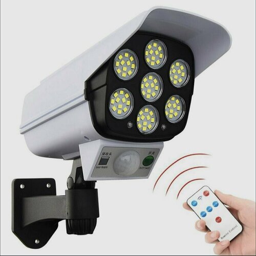 Мощный настенный уличный светодиодный светильник прожектор 2 в 1 с датчиком движения Муляж камеры наблюдения на солнечной батарее с пультом дистанционного управления 3 режима яркости водонепроницаемый оригинал 77 LED
