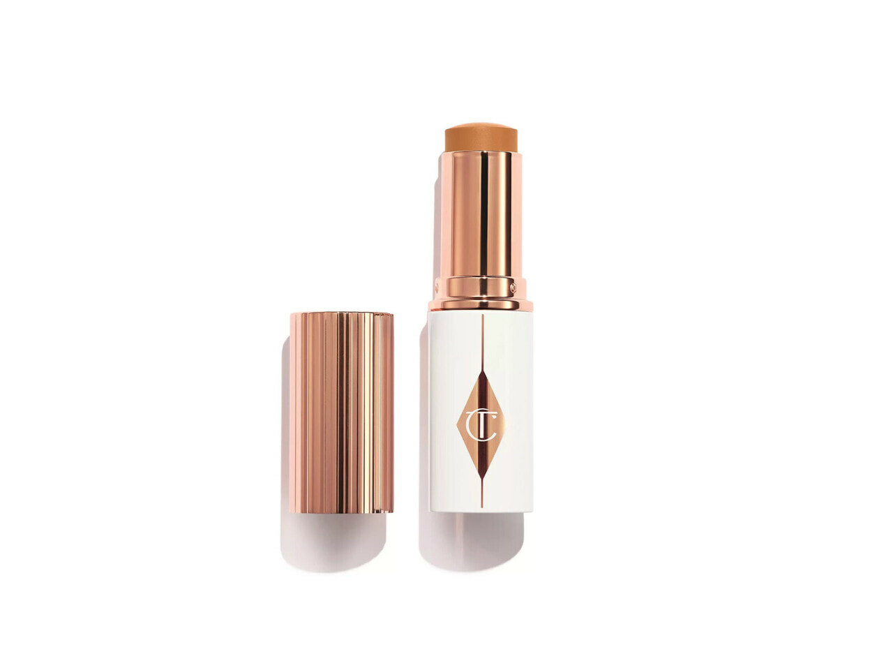 Тональный крем-стик Charlotte Tilbury Unreal Skin Sheer Glow Tint, 12 Tan
