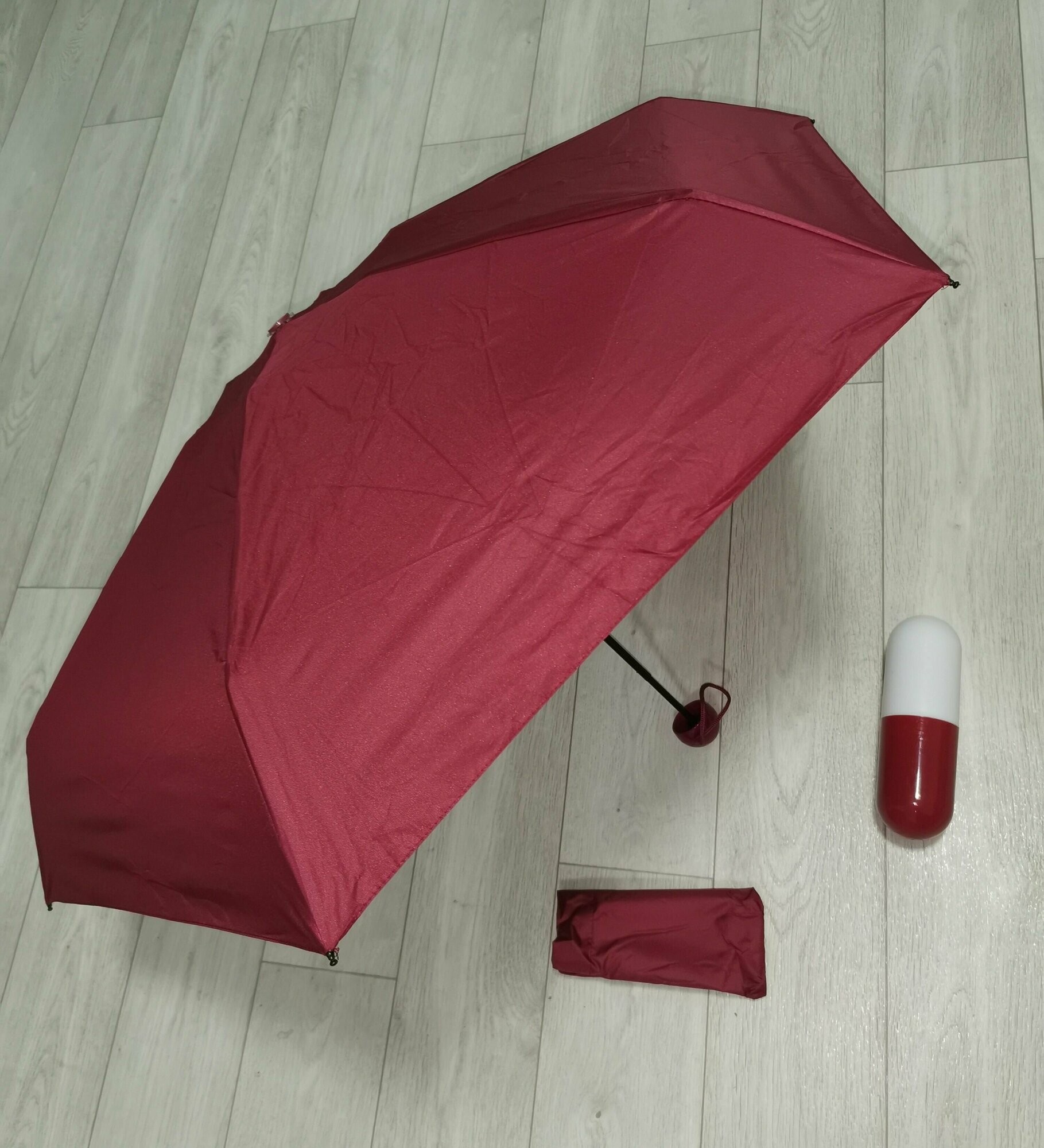 фото Мини зонт красный карманный механический (капсула, таблетка)