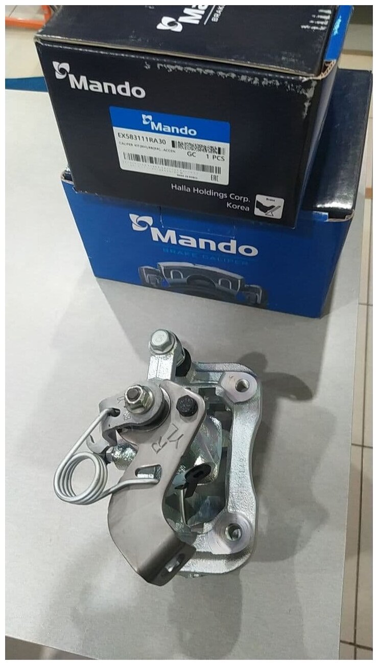 Суппорт тормозной задний правый MANDO EX583111RA30 для Hyundai Solaris, Kia Rio - фотография № 17