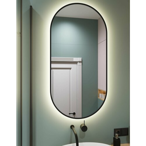 Овальное зеркало капсула в тонкой черной раме 12672 см с нейтральной подсветкой и датчиком на взмах руки 17500₽