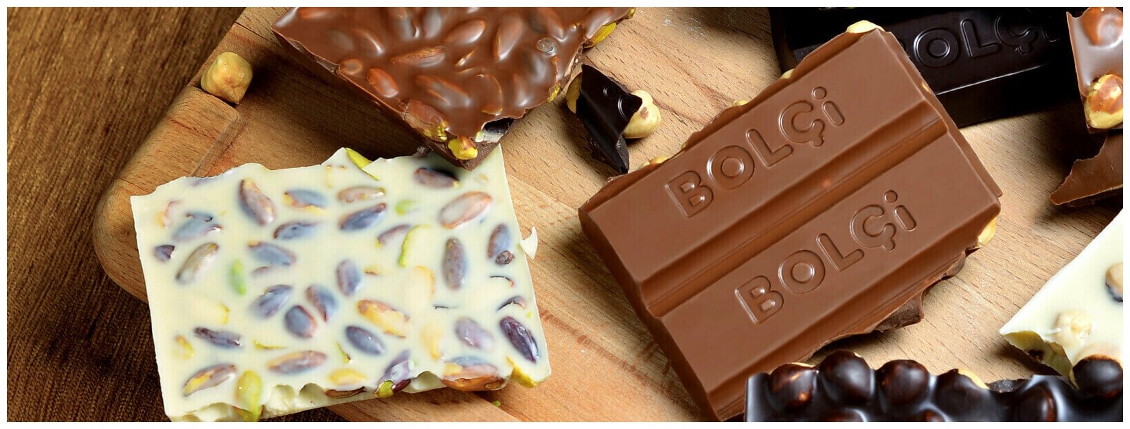 Молочный шоколад Bolci "BiMola" с лесным орехом и изюмом нетто 70 г - фотография № 2