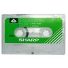 Аудиокассета SHARP демонстрационная зелёная для магнитофонов SHARP. Бланк. - изображение