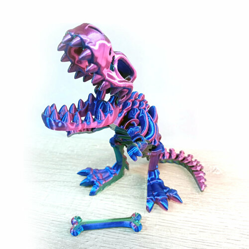 фото Динозавр-скелет ти-рекс (t-rex dino) с косточкой, гибкая фигурка, трехцветный