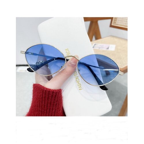 Женские солнцезащитные очки овальной формы с синими линзами в стальной оправе