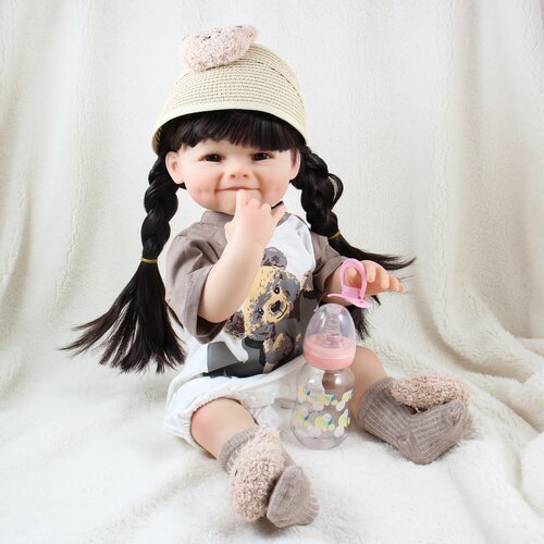 Виниловая кукла Реборн (Reborn Dolls) - Девочка в свитере с мишкой, с улыбкой (56 см)