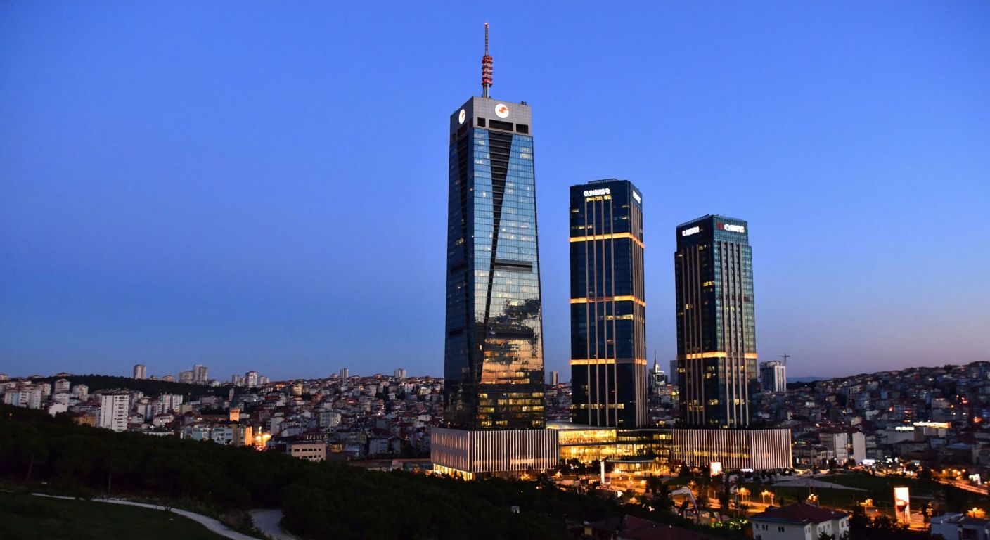 A modern Istanbul skyline with sleek corporate towers representing Koç, TURK, and Sabancı Holdings, illuminated against a twilight sky, reflecting their prominence in Turkey's economy.
