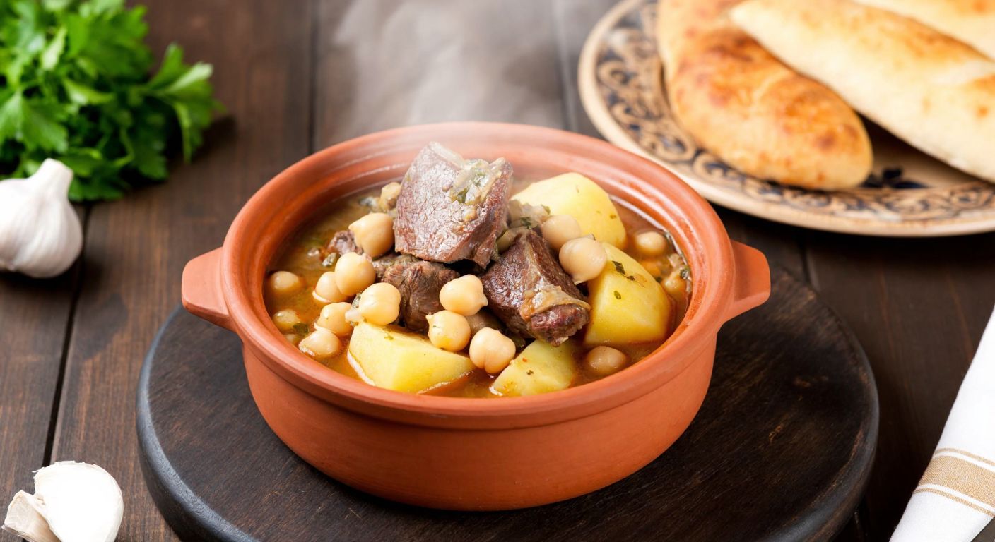 A steaming clay pot of **piti** with tender lamb, chickpeas, and potatoes, placed on a rustic wooden table in a cozy **Kars** home, surrounded by warm bread and fresh herbs.