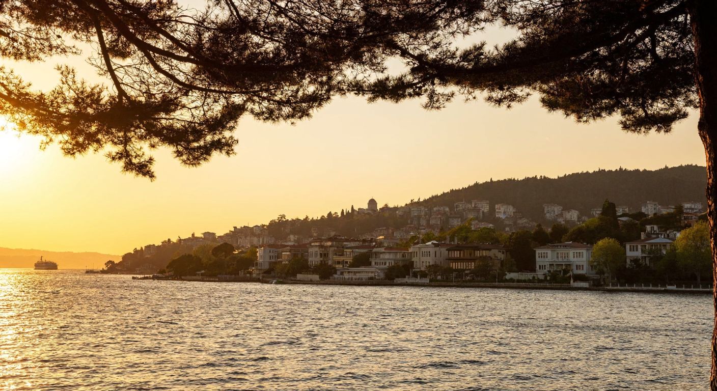 A serene view of the Bosphorus from Kandilli, with historic Ottoman-era mansions lining the shore, lush greenery of Cemile Sultan Grove in the foreground, and the silhouette of Kandilli Observatory perched on a hill under a golden sunset.