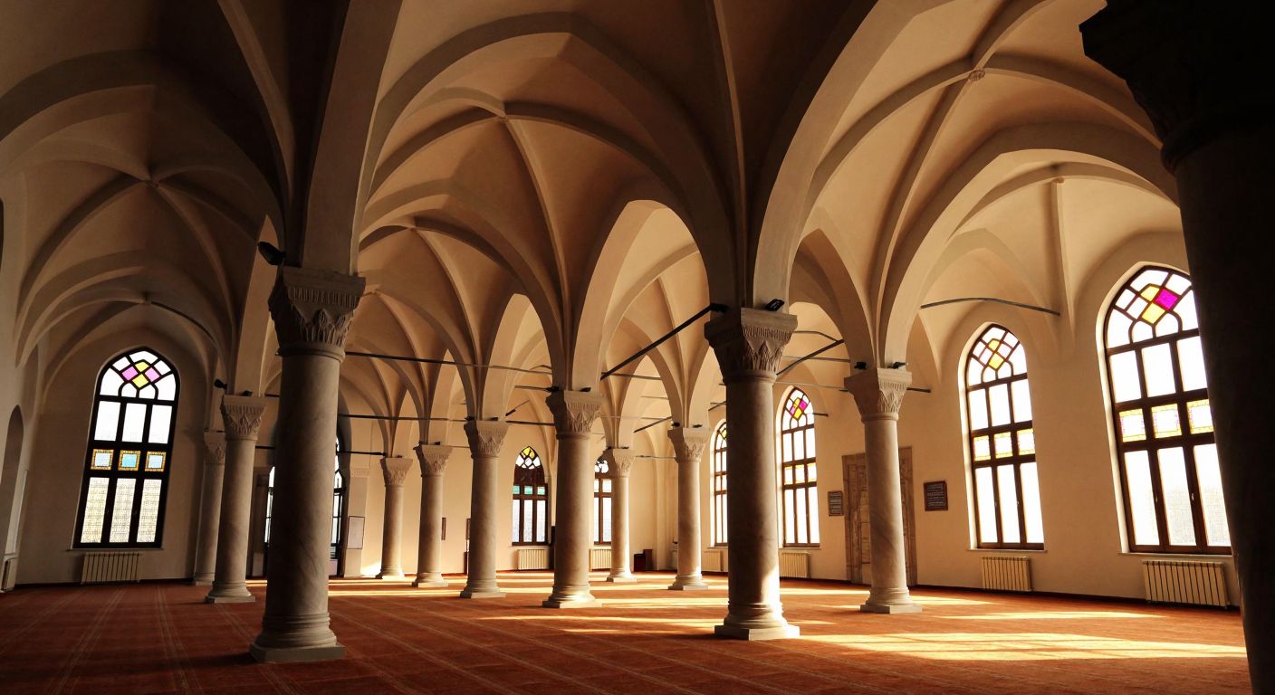 A grand Ottoman-era mosque interior with various arched vaults—semicircular barrel vaults, pointed cross vaults, and conical vaults—illuminated by soft sunlight filtering through stained glass windows.