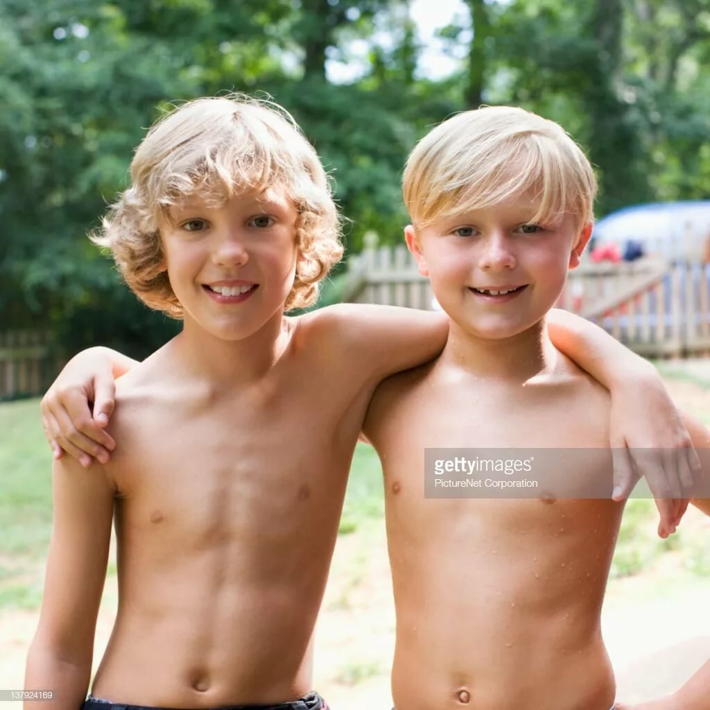 Caucasian Boys Hugging Outdoors Stock Photo Getty Images