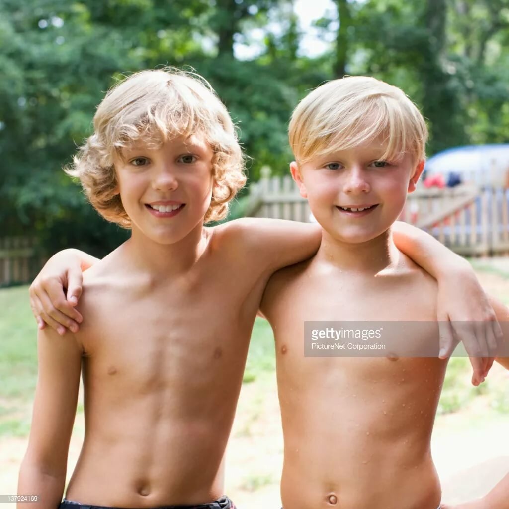 Caucasian boys hugging outdoors stock photo getty images in yandex