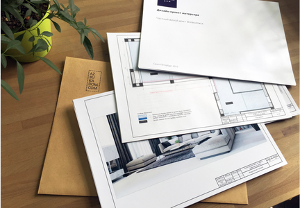 папка с чертежами на столе