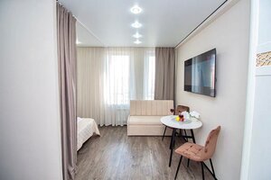 Апартаменты Эксклюзивная Студия в Центре - Четыре Сезона