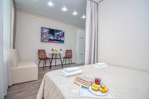 Апартаменты Эксклюзивная Студия в Центре - Четыре Сезона