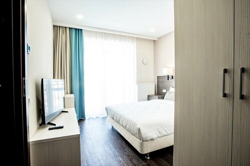 Гостиница Ramada Hotel & Suites by Wyndham Novosibirsk в Садовом