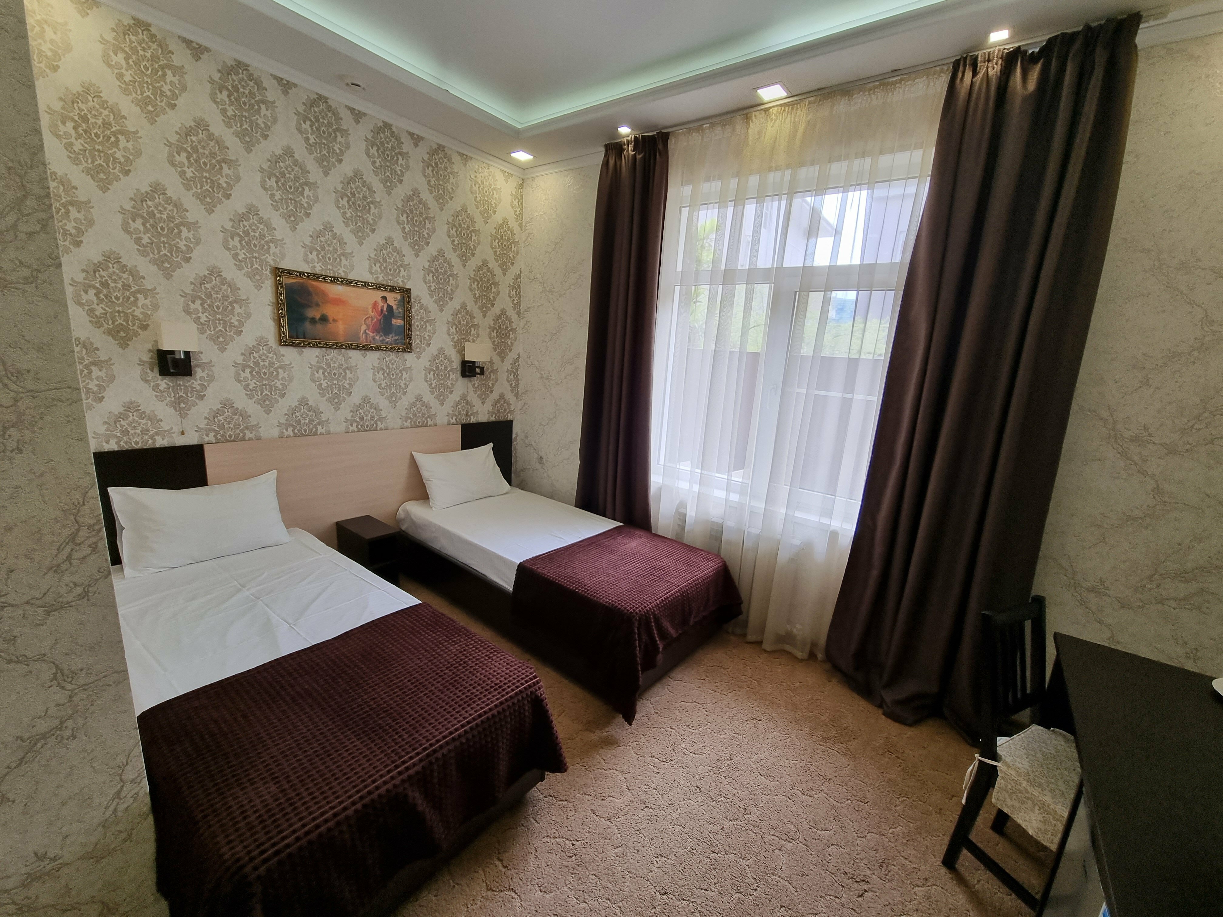 Двухместный номер с 2 отдельными кроватями и душем