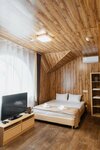 Улучшенный четырехместный номер в A-House Hotel