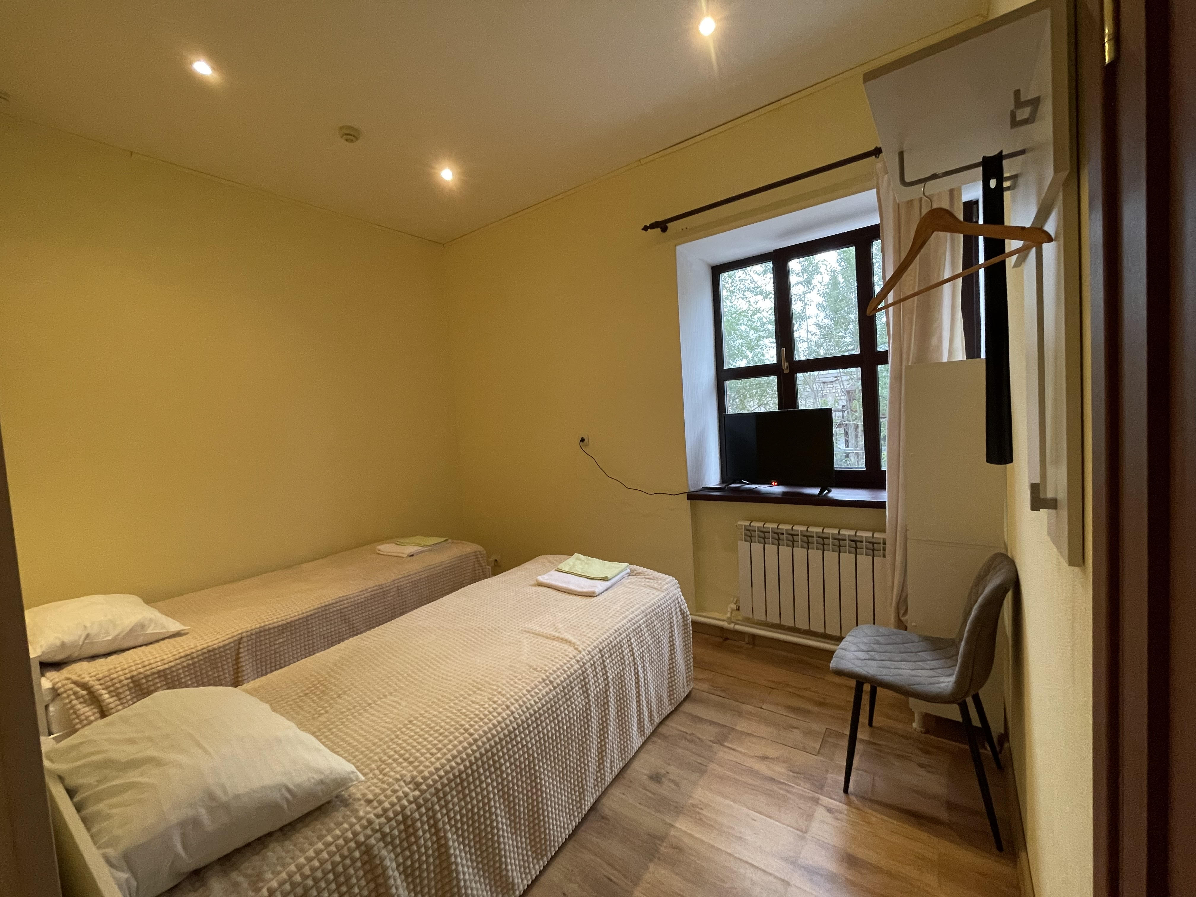 Двухместный номер с 2 отдельными кроватями и душем