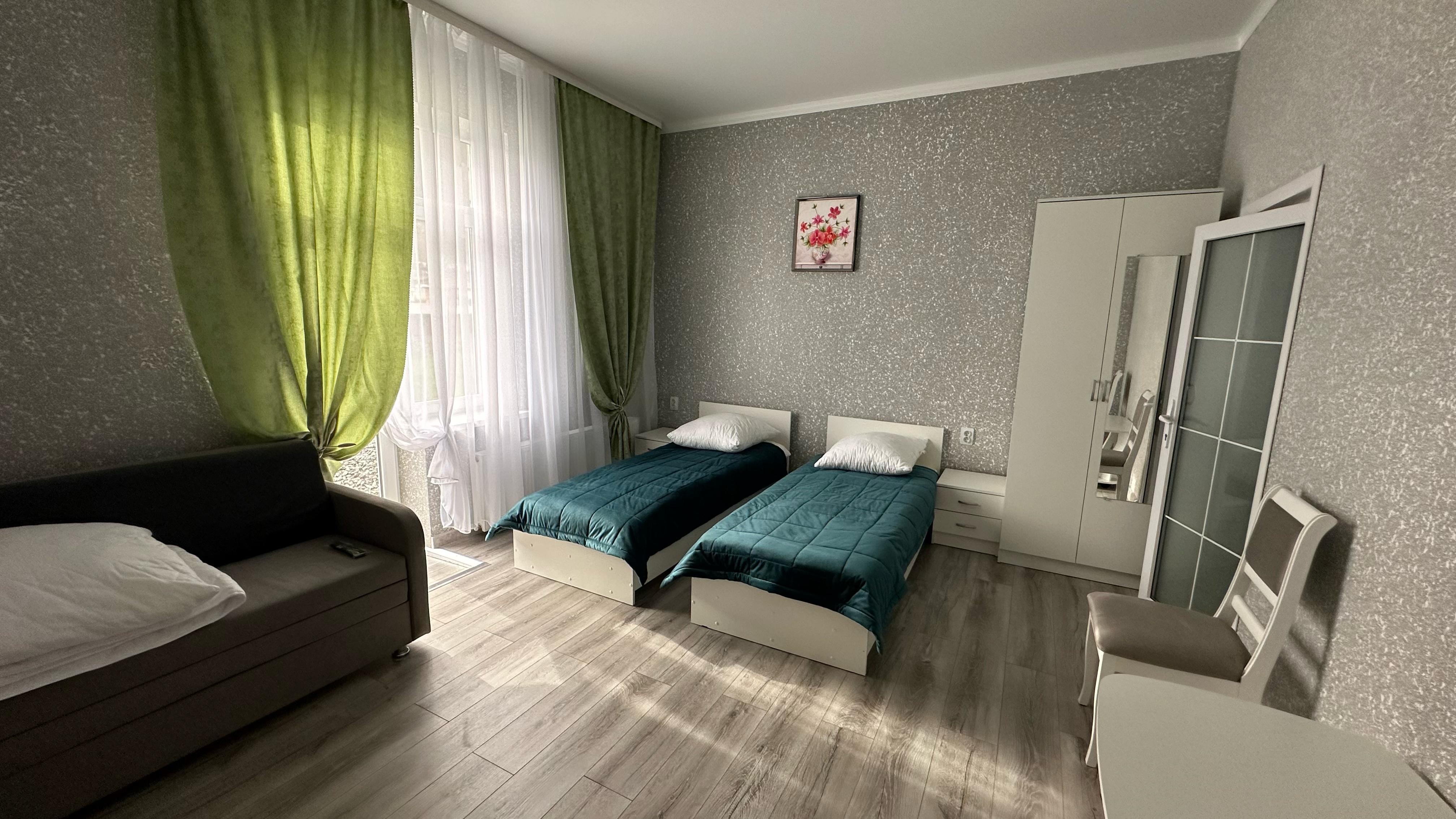 Трехместный номер Делюкс