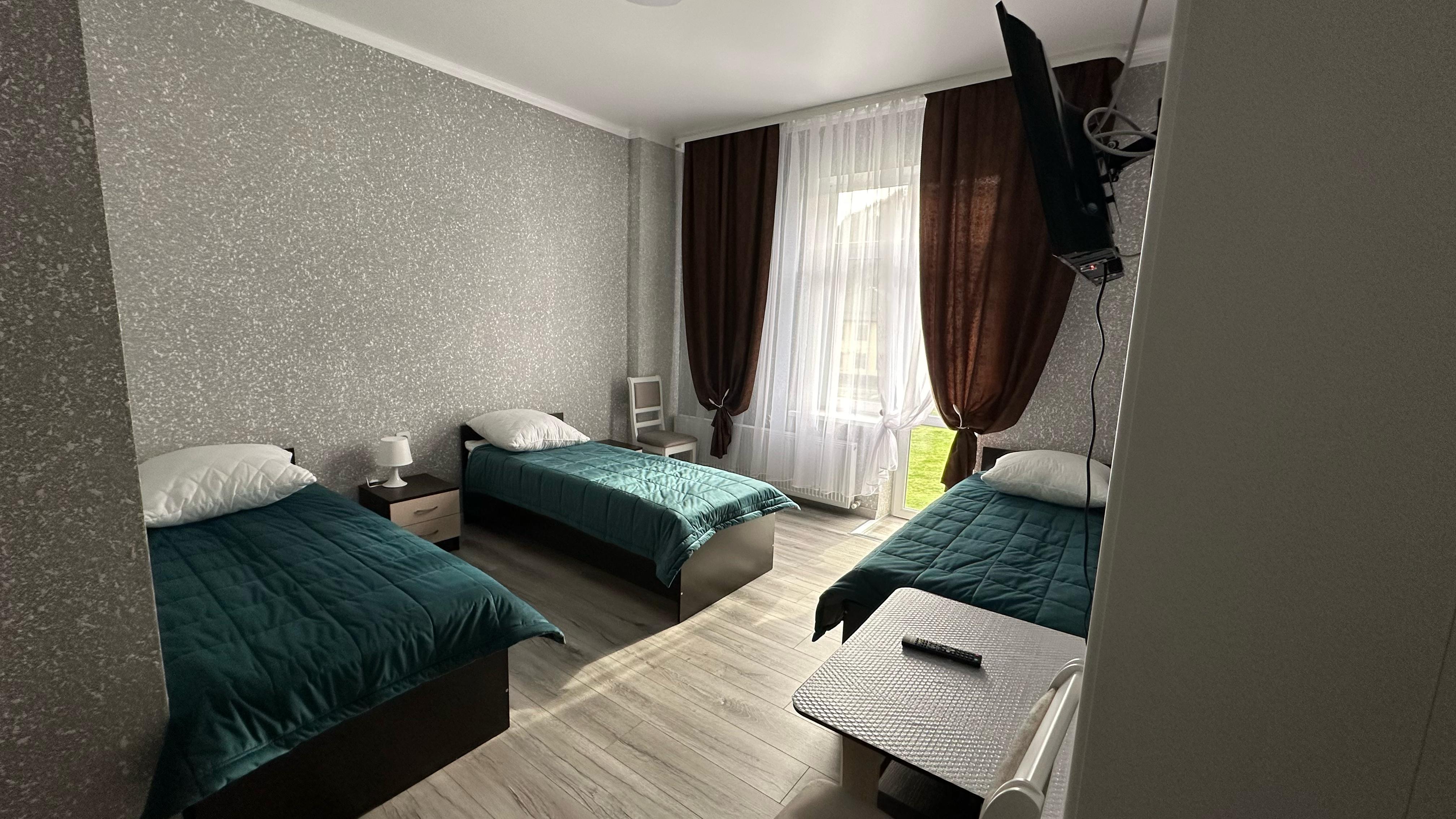 Трехместный номер Делюкс