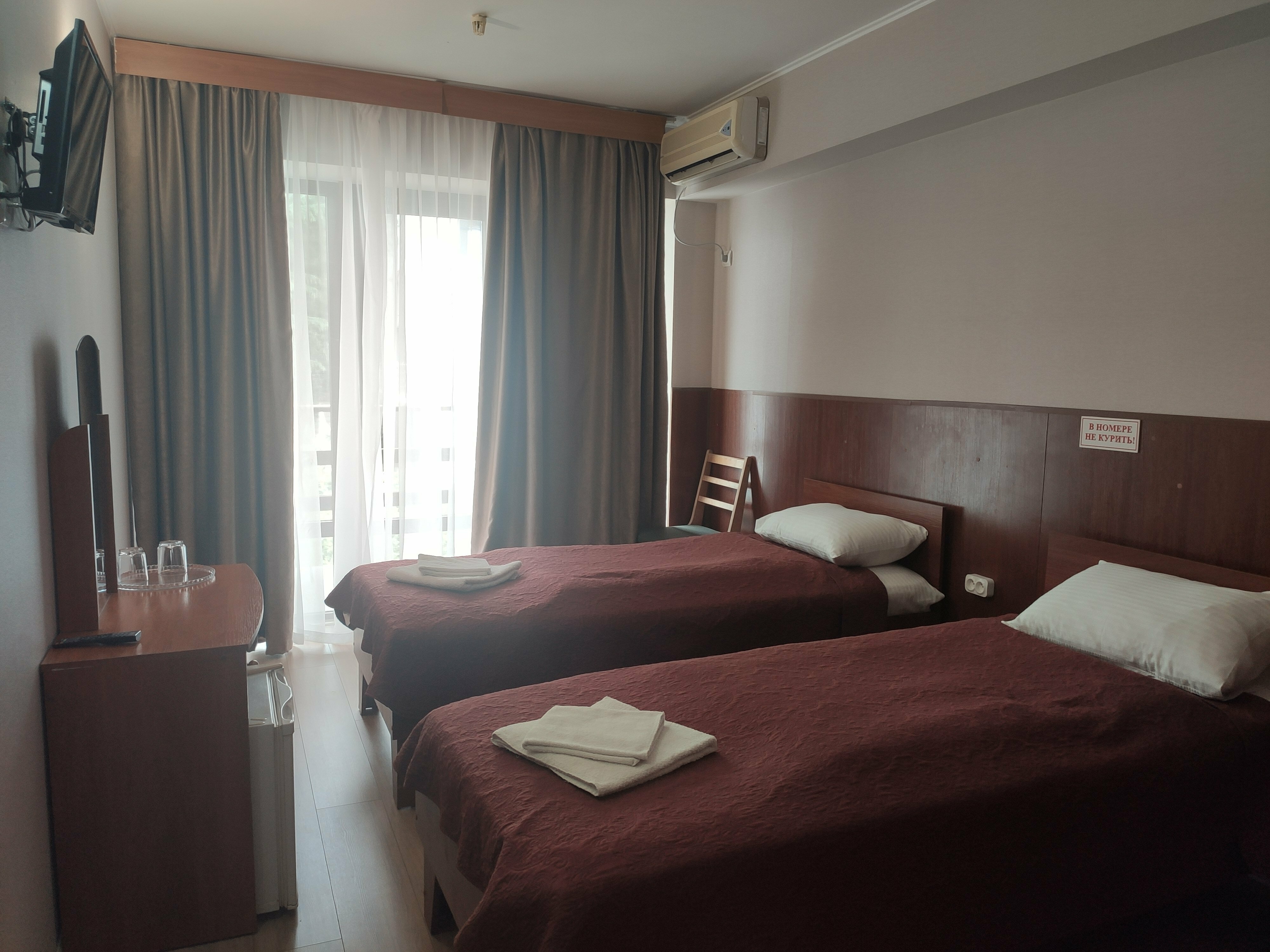 Двухместный номер с 2 отдельными кроватями и балконом