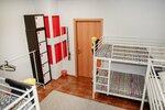 Спальное место на двухъярусной кровати в общем номере для мужчин в Вагон