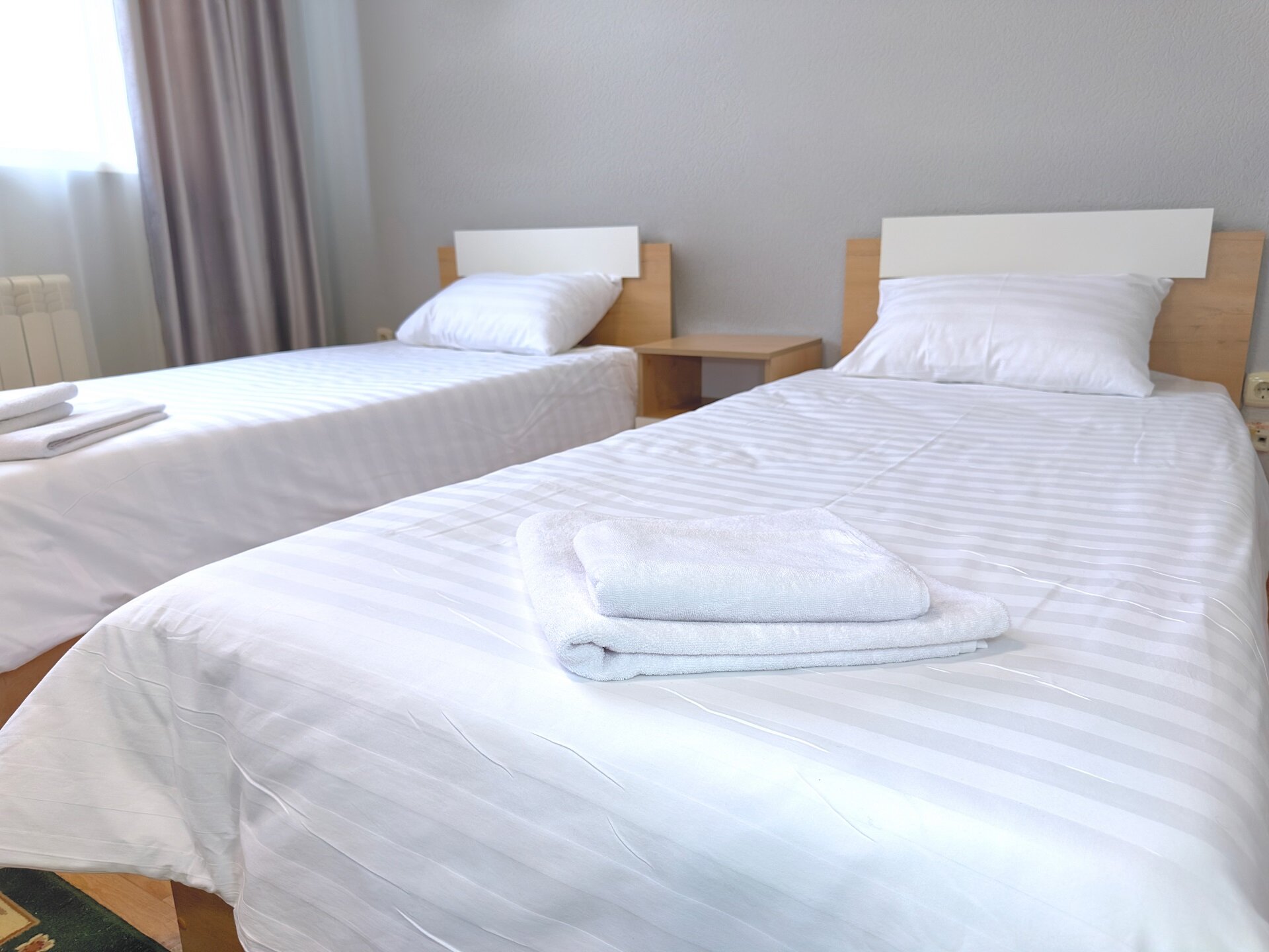 Трехместный номер с собственной ванной комнатой