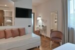 Номер «Джуниор», вид на сад в Hotel Torresi
