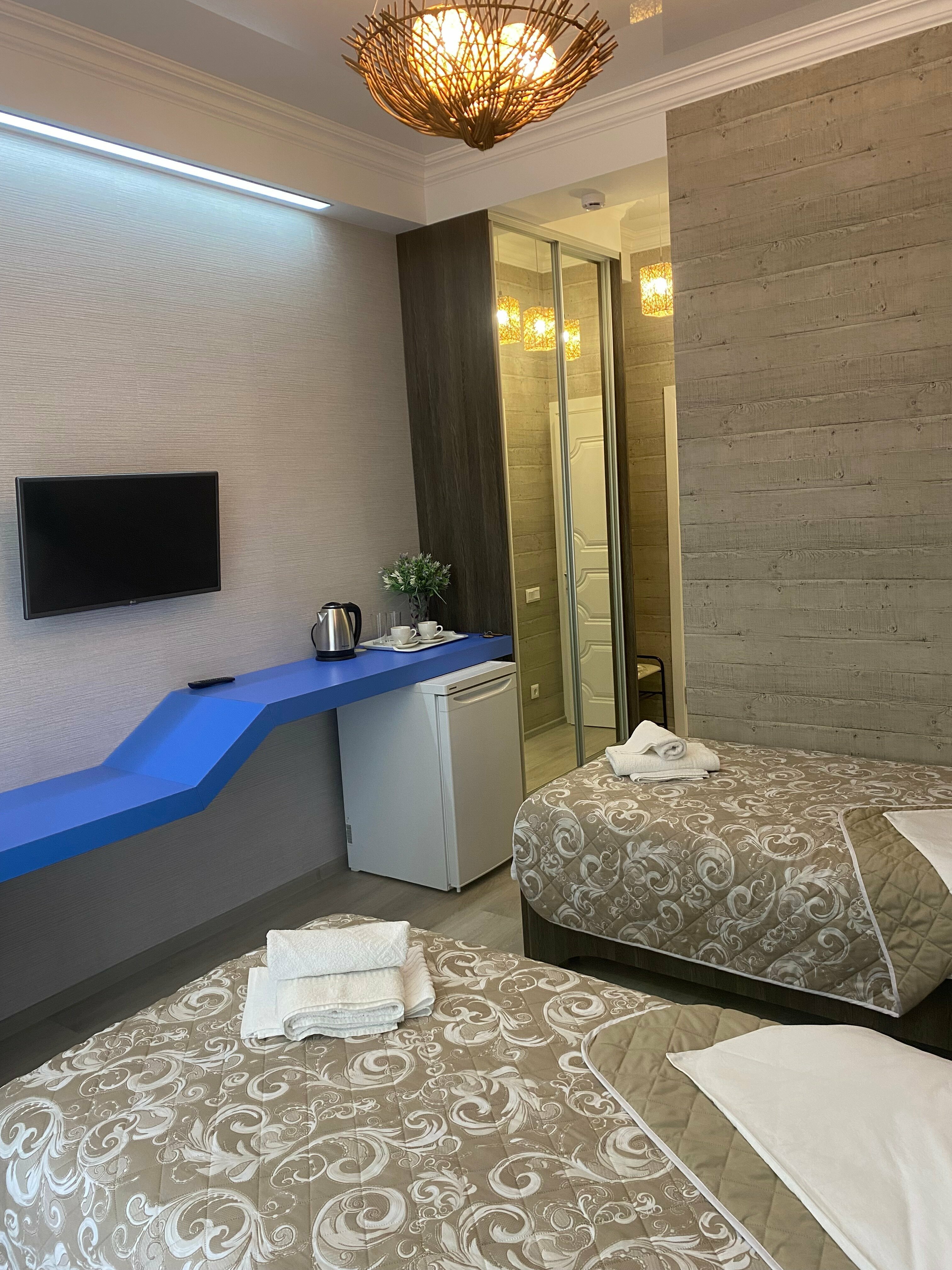 Двухместный номер с 2 отдельными кроватями и балконом