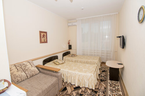 Стандартный номер с 2 односпальными кроватями и дополнительным местом