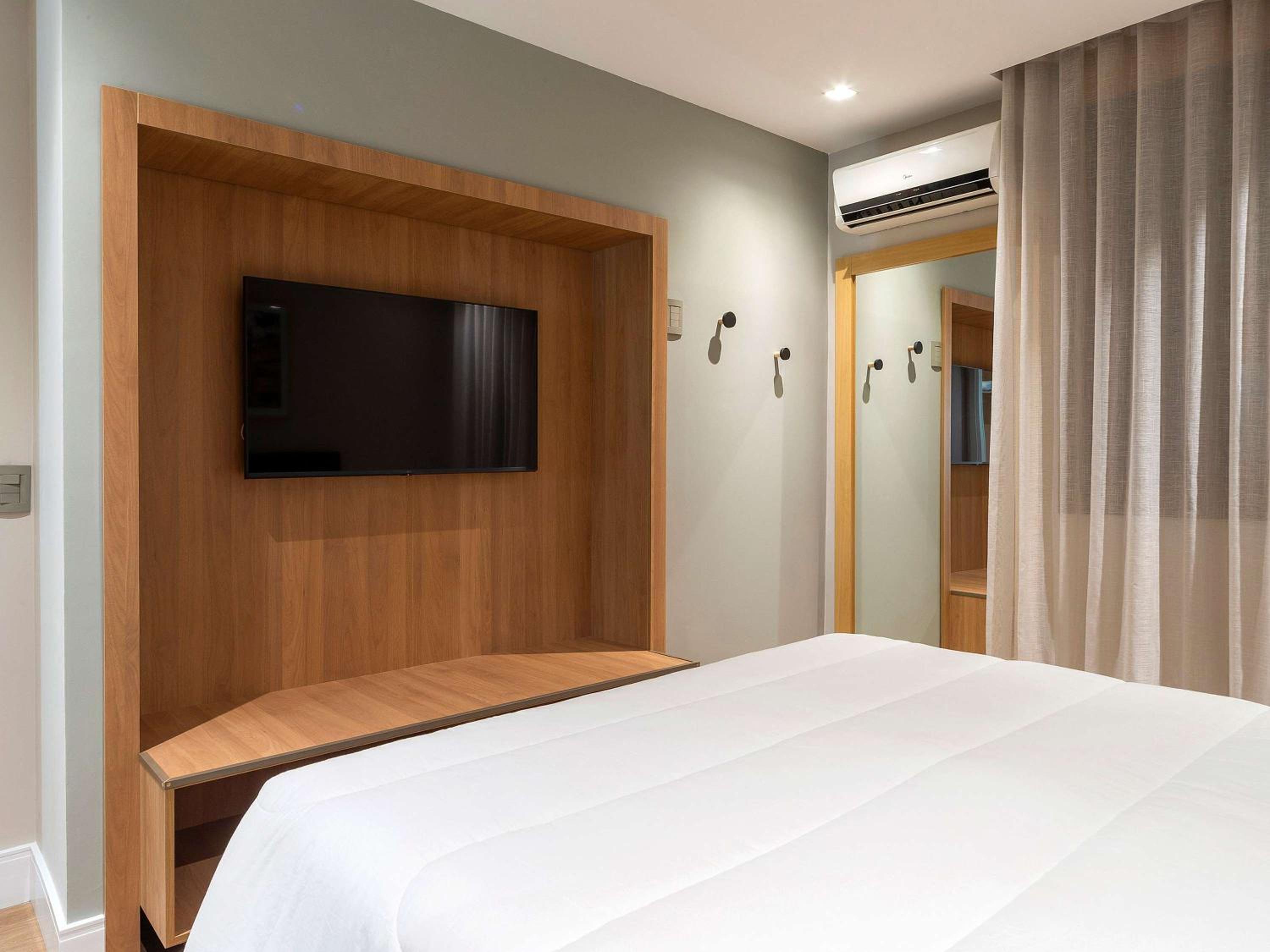Executive Room with a Queen Bed and a Sofa