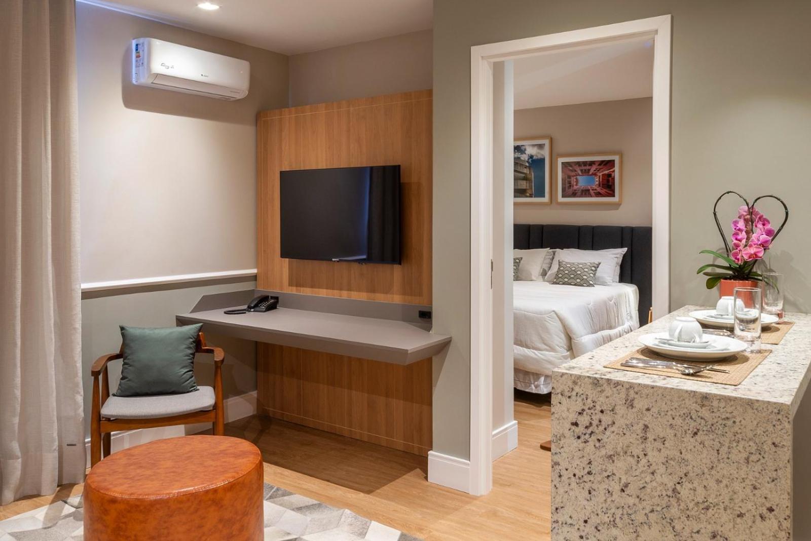 Executive Room with a Queen Bed and a Sofa
