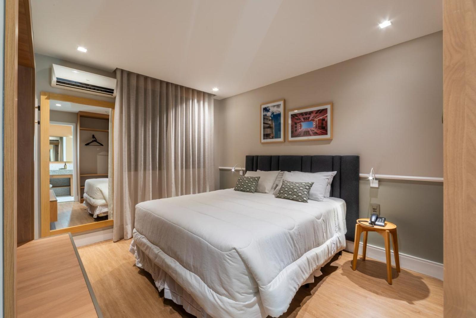 Executive Room with a Queen Bed and a Sofa