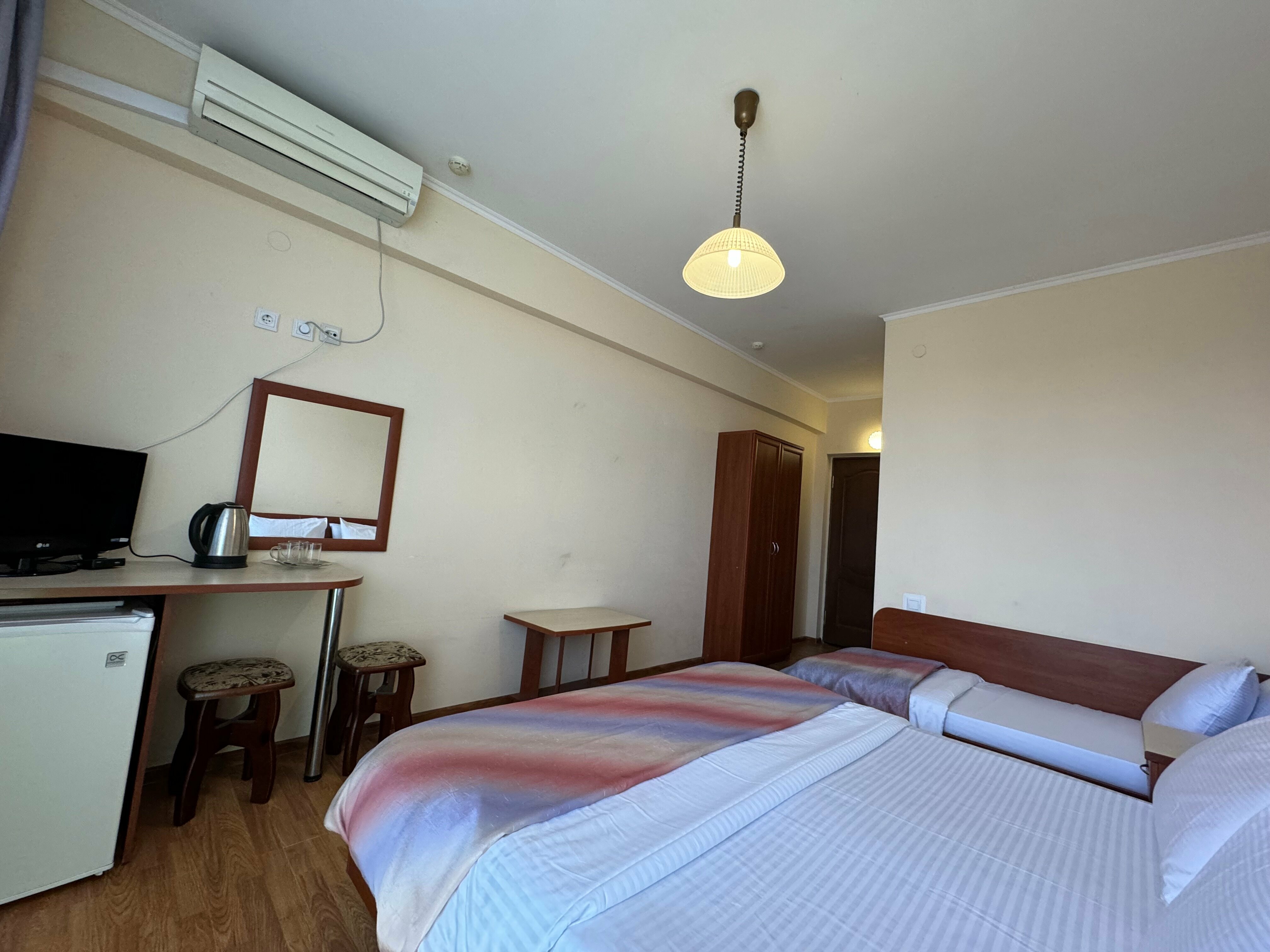 Трехместный номер с балконом