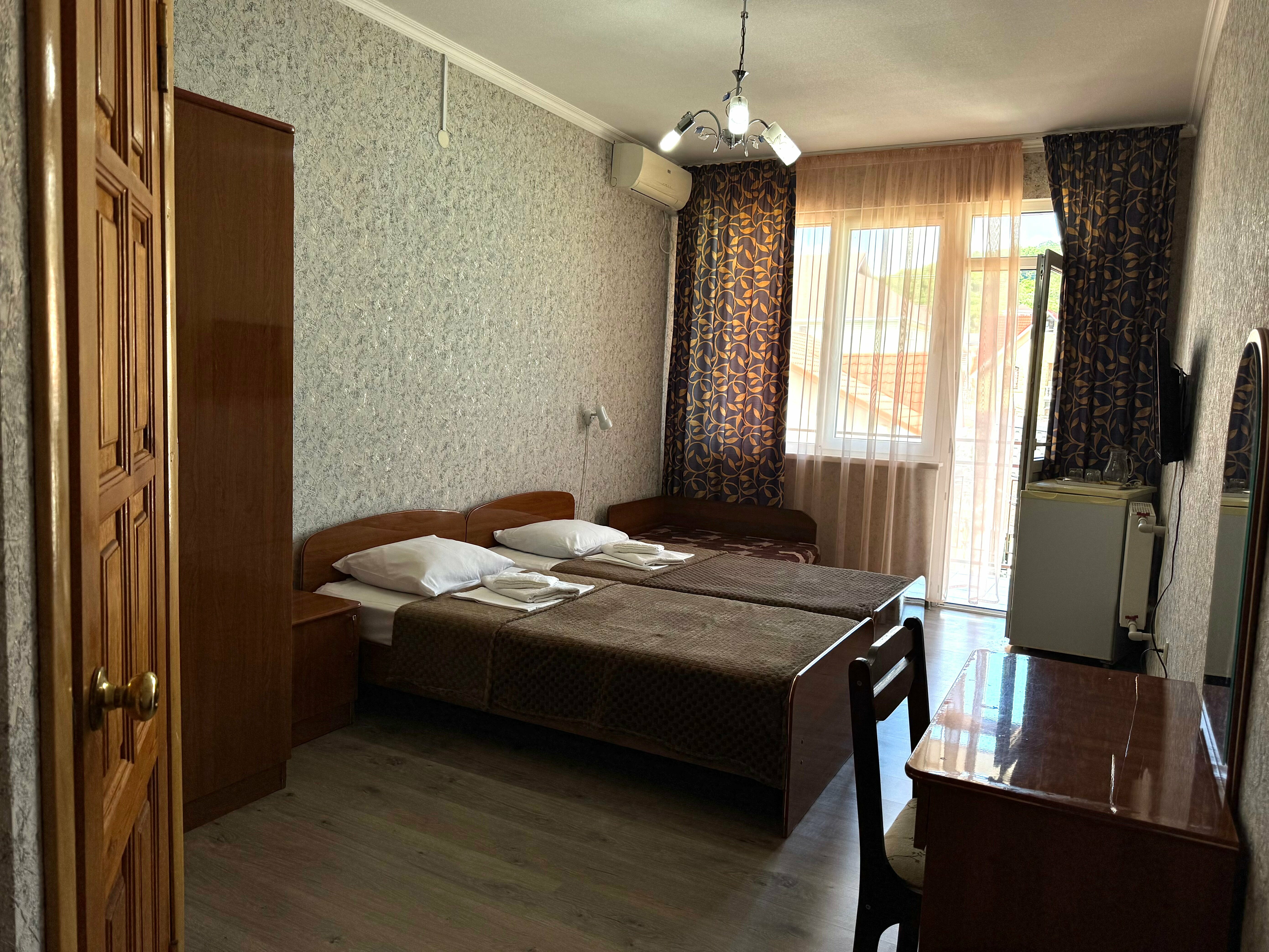 1-комнтаная двухместная с двумя односпальными кроватями и балконом