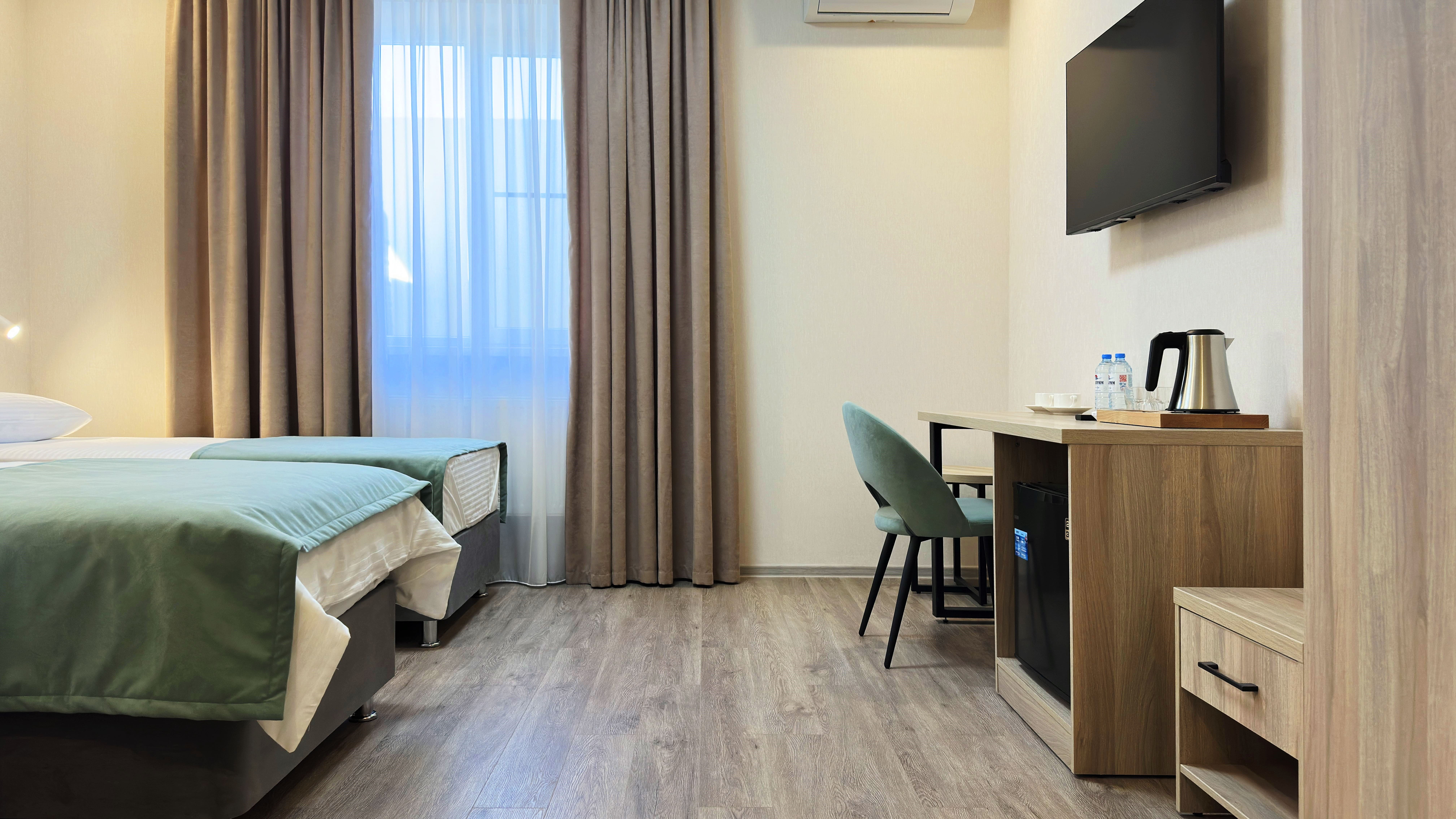 Улучшенный двухместный номер с 2 отдельными кроватями