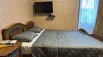 Бюджетный трехместный номер в Апартаменты Адель