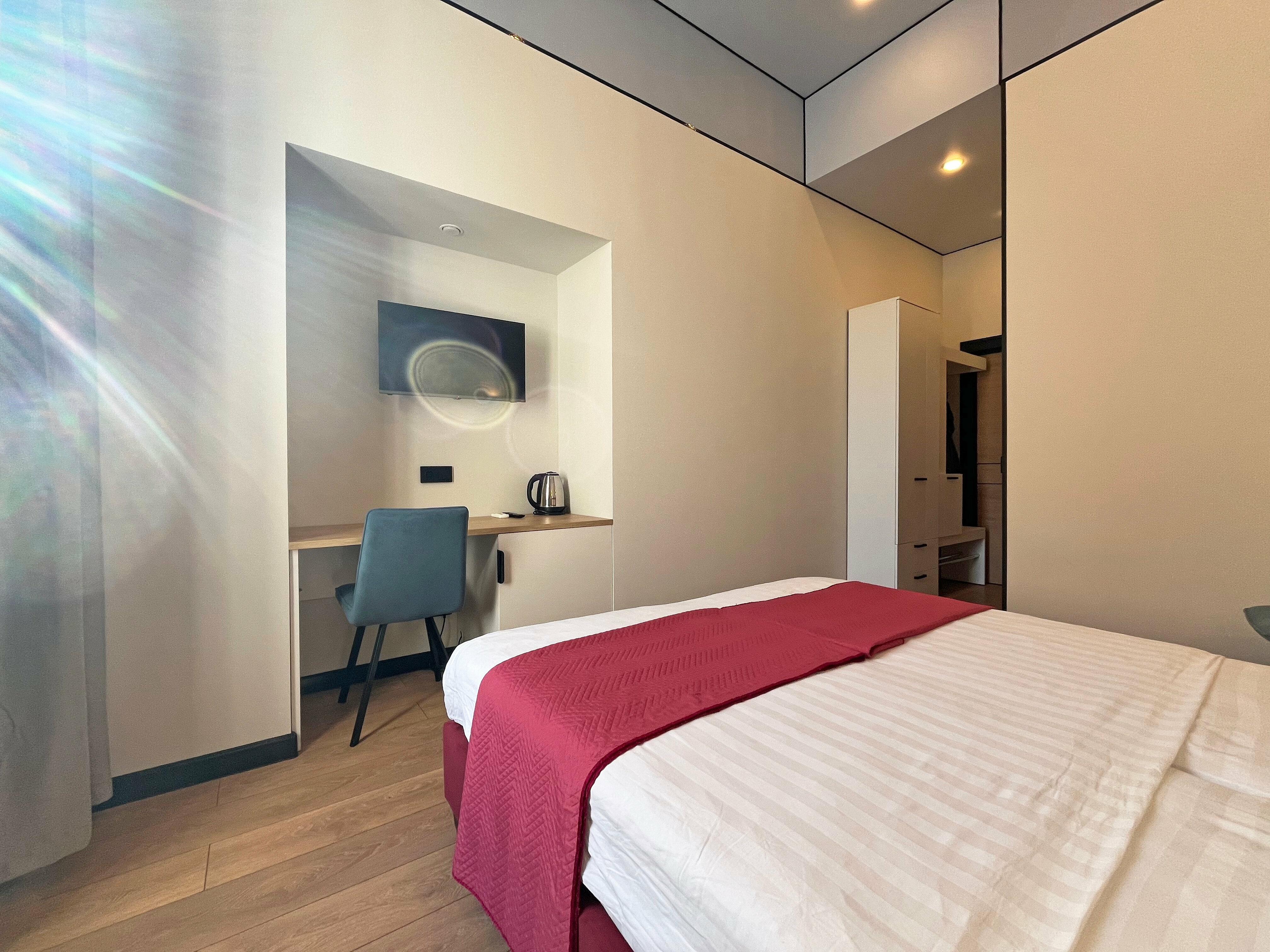 Стандартный улучшенный двухместный номер с одной большой или двумя односпальными кроватями